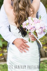 Back view of bride with flower. Hair Laurel Stratford