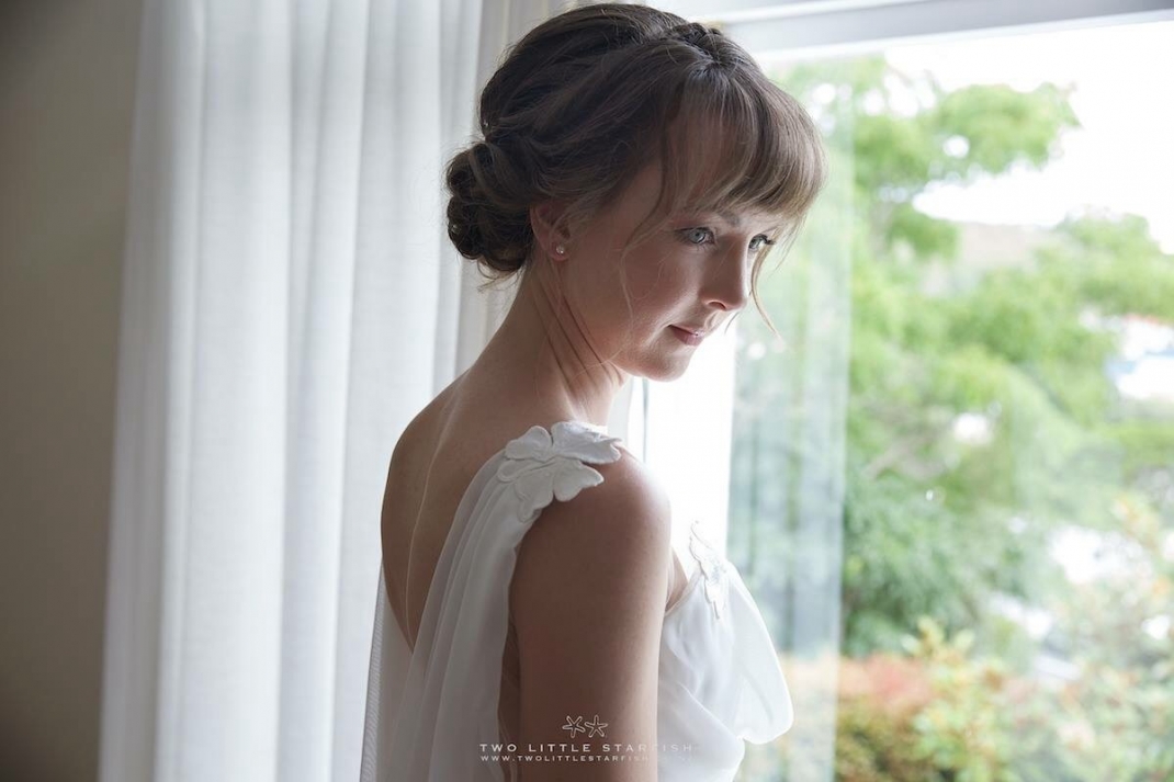 The Bride in her gown before. Getting married. Hair Laurel StratfordHairstyist