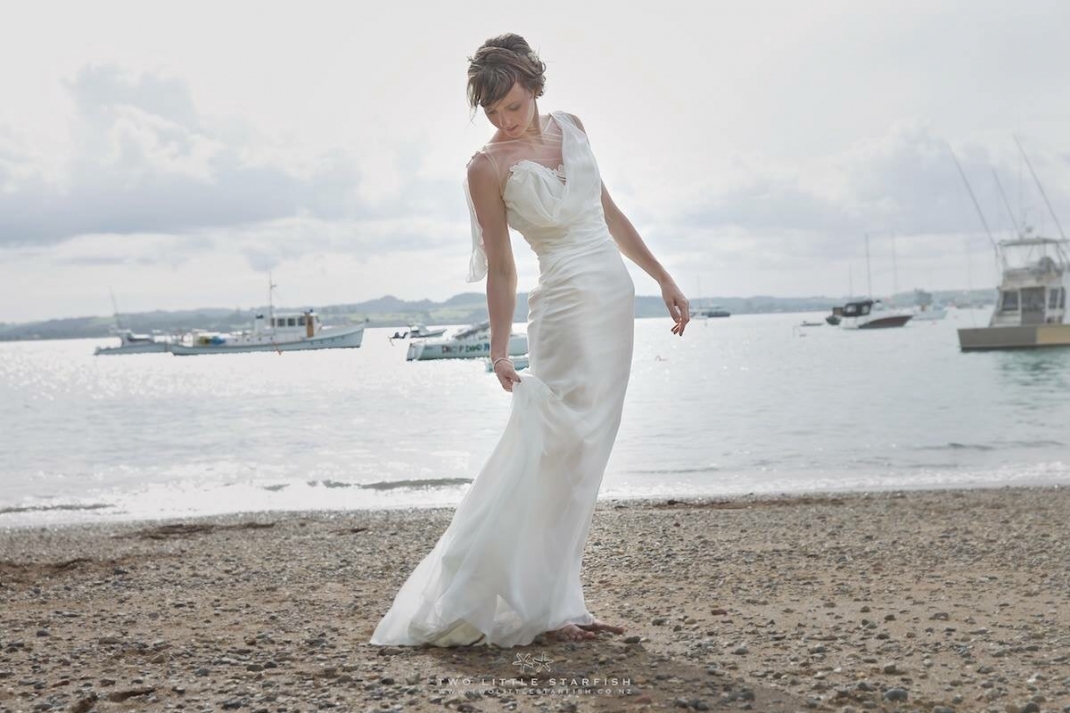 Bride on beach, Russell,NZ. Hair Laurel Stratford Hairstyist.