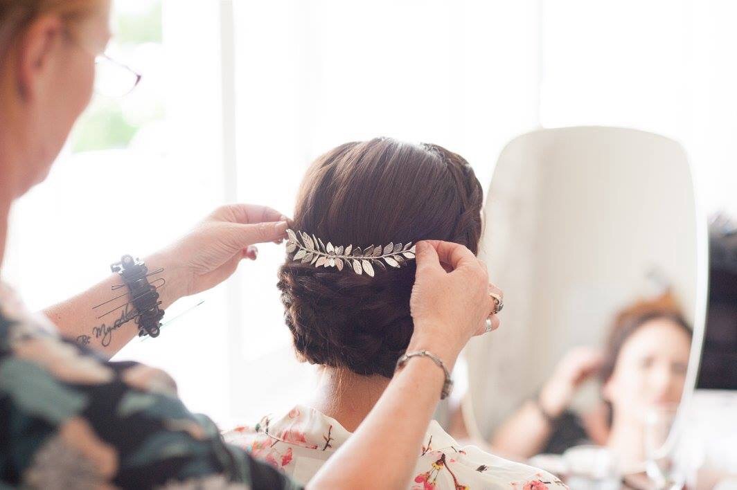 Bridal accessory being added to Bride