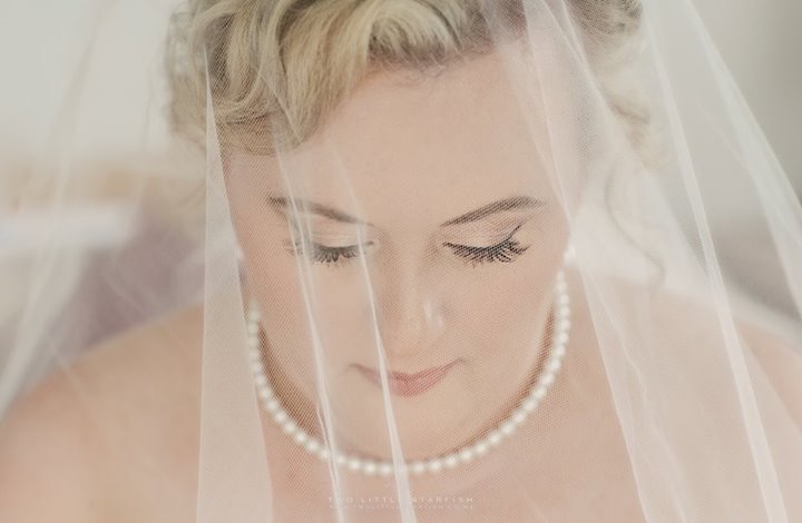 the bride with her veil over her face, Kerikeri wedding, hair Laurel Stratford