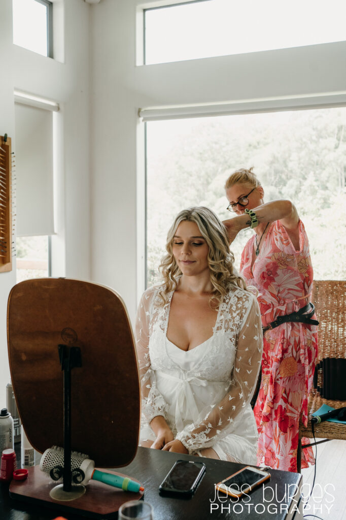 hairstylist finishing Brides hair