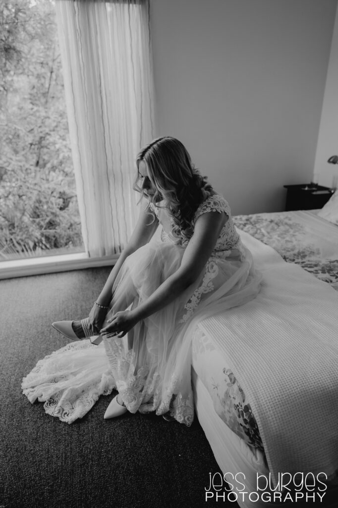 Bride putting on her shoes