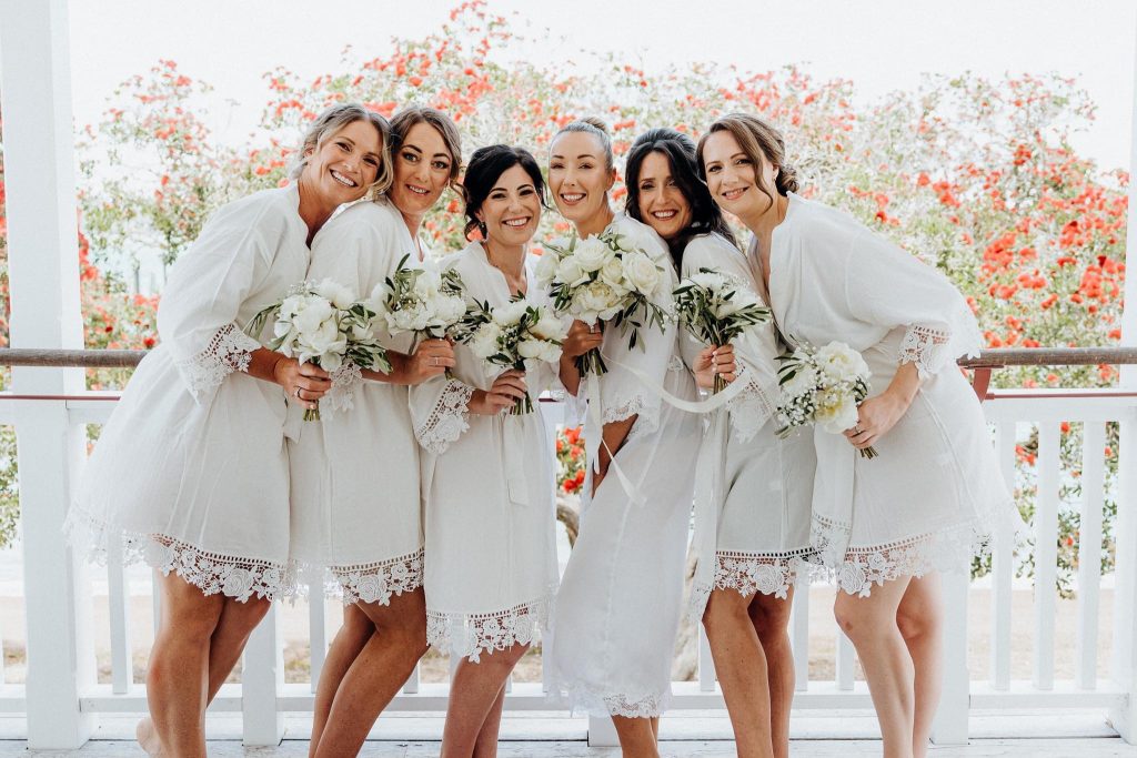 Bridesmaids and Bride almost ready to dress